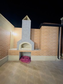 Buzovnada Mərdəkan yolunda evlərin sıx yerləşdiyi ərazidə Qoşa Qala restoranı ətrafında həyət evi, -16
